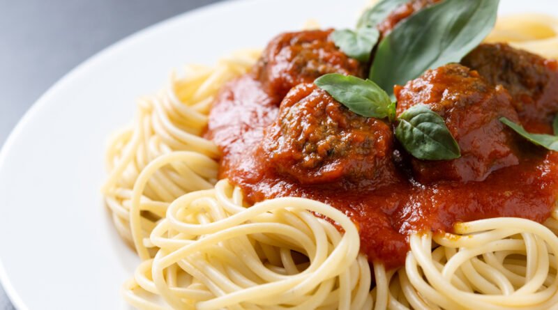 Spaghetti With Meatballs On Black Background